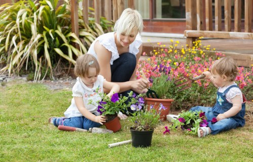 Team working on a domestic garden in Seven Kings, preparing a planting area