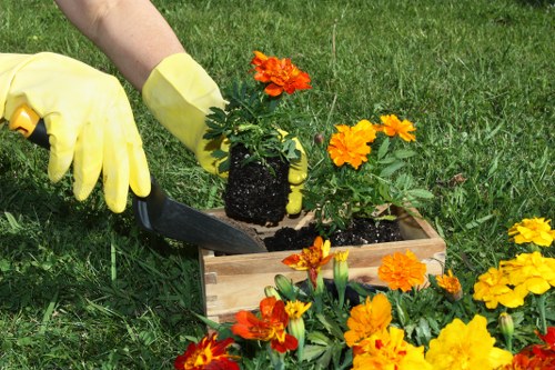 Crew separating garden waste on-site following borough recycling streams