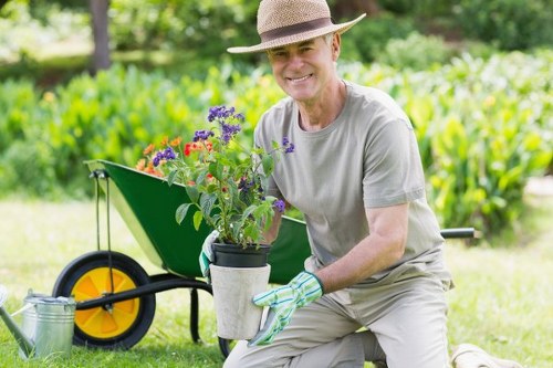 Professional lawn mower trimming grass in Seven Kings